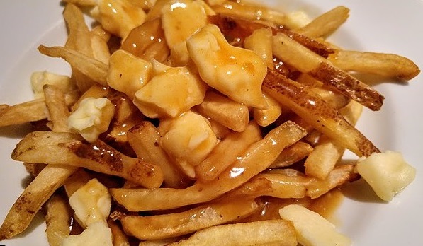 Poutine. Image by Camelia Boban CC BY-S- 4.o via Wikimedia Commons Poutine on plate